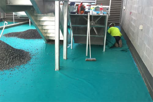 Remedial waterproofing and concrete repair work in progress on a commercial site